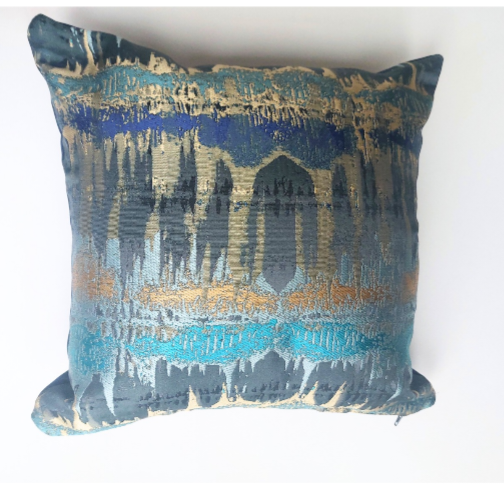Elements print cushion in teal and bronze