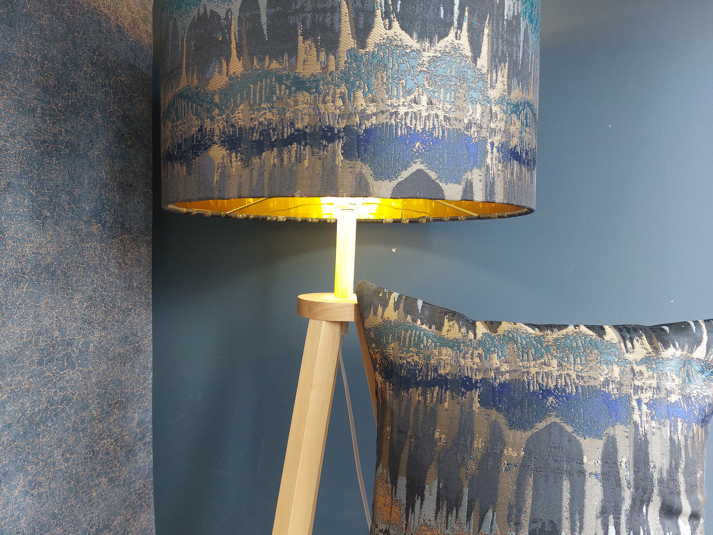 Elements print cushion in teal and bronze