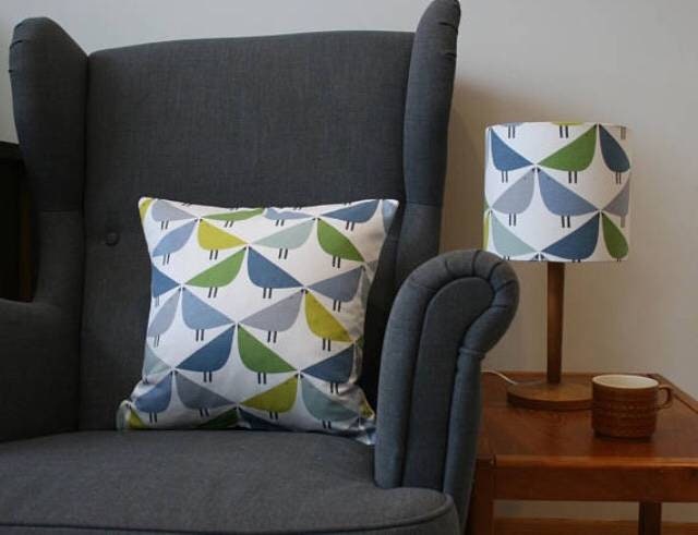 Love bird print cushion in blue, green and grey