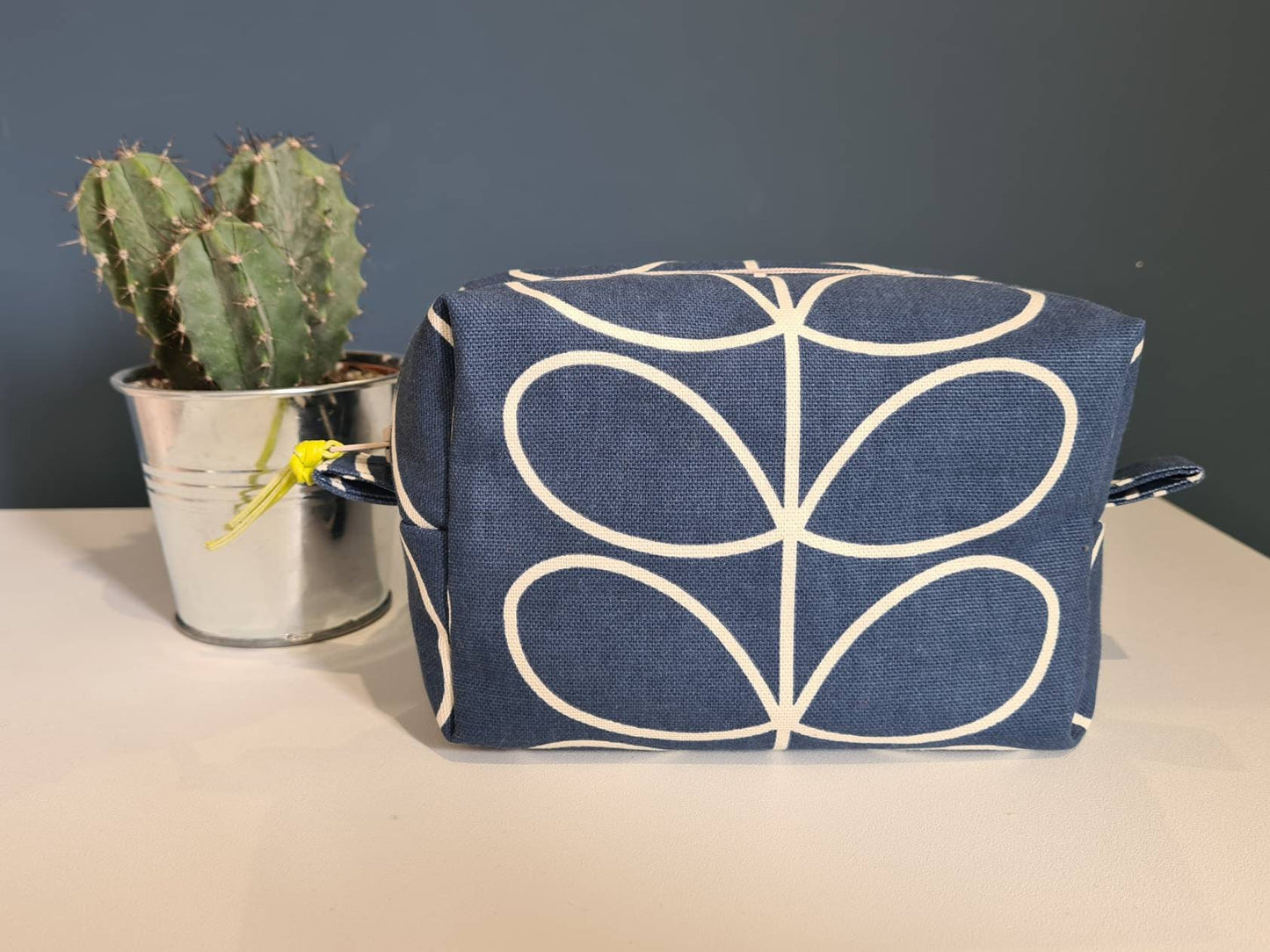 Linear stem print cosmetic bag in dark blue