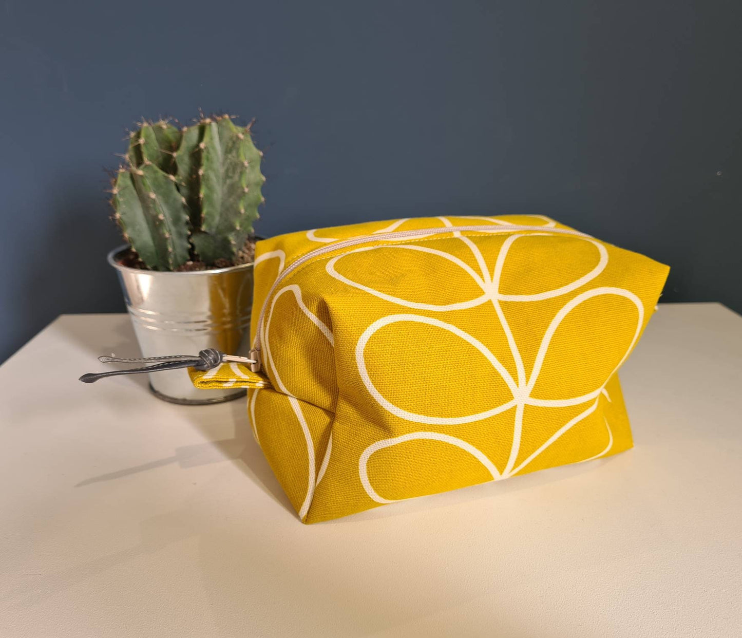 Linear stem print cosmetic bag in mustard