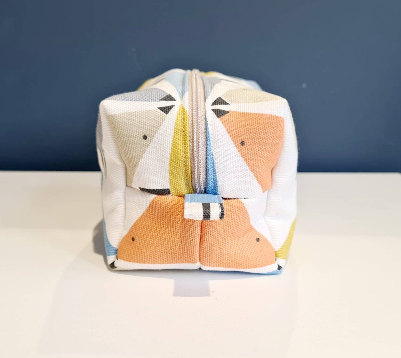 Lovebird print cosmetic bag in blue, yellow and orange