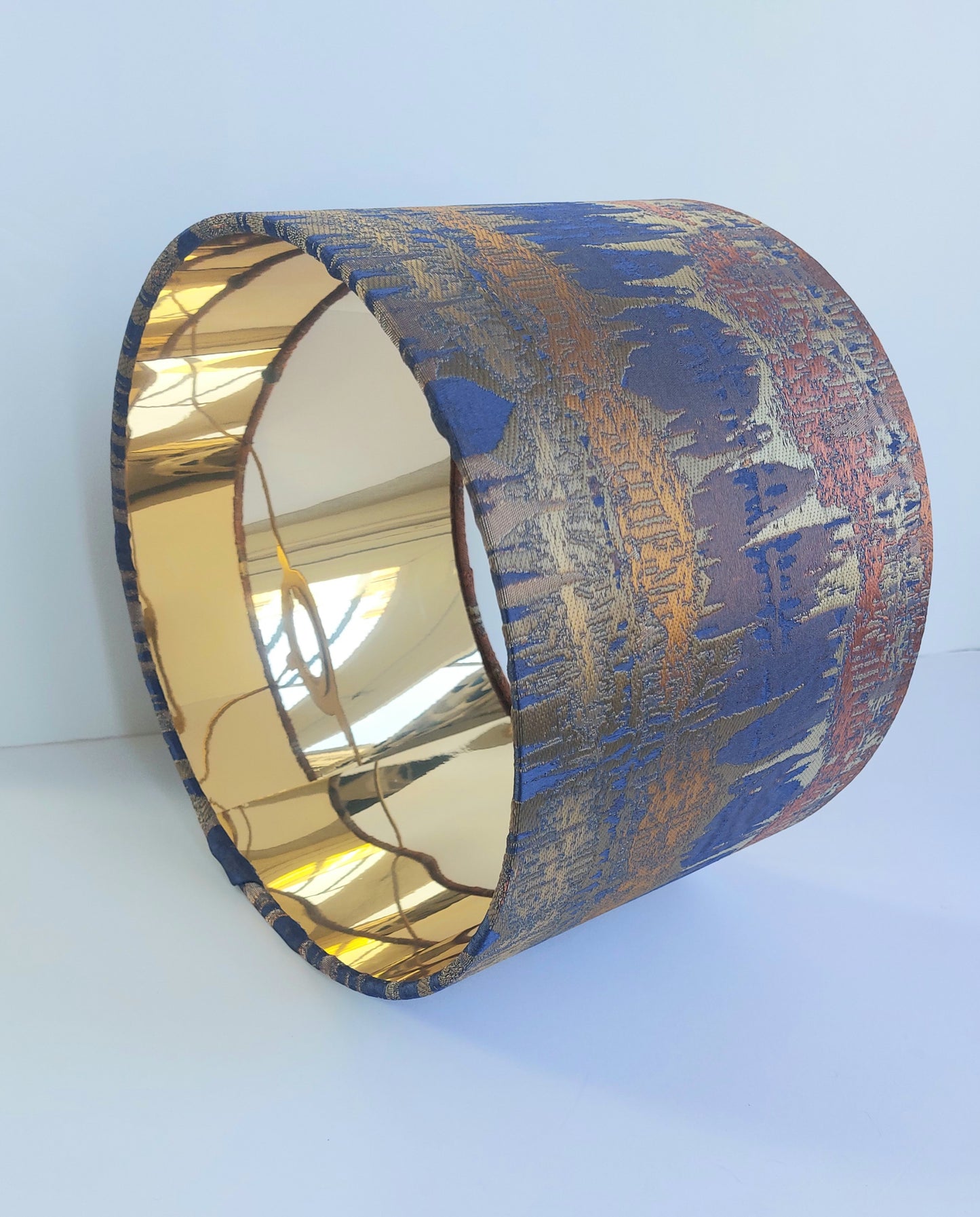 Elements print in blue and cooper with mirror gold lining
