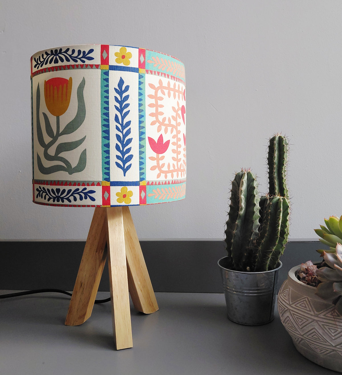 Scandi style tile print lampshade in red, blue and green. Kitsch folk art flower print shade