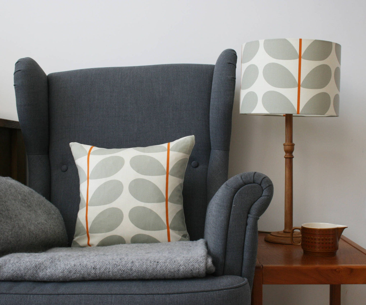 Large stem print cushion in orange and grey