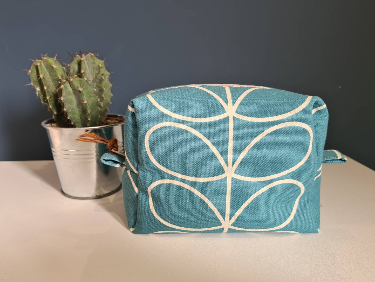 Linear stem print cosmetic bag in teal