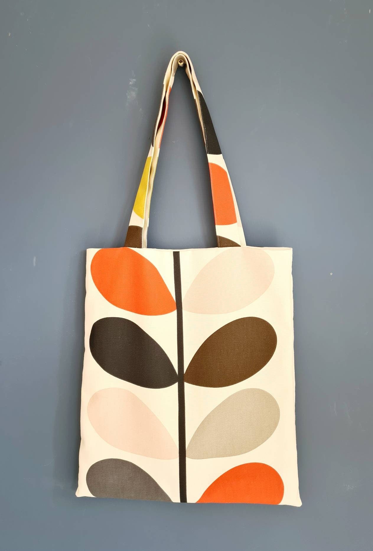 Multi stem print fabric tote bag in red, green and mustard