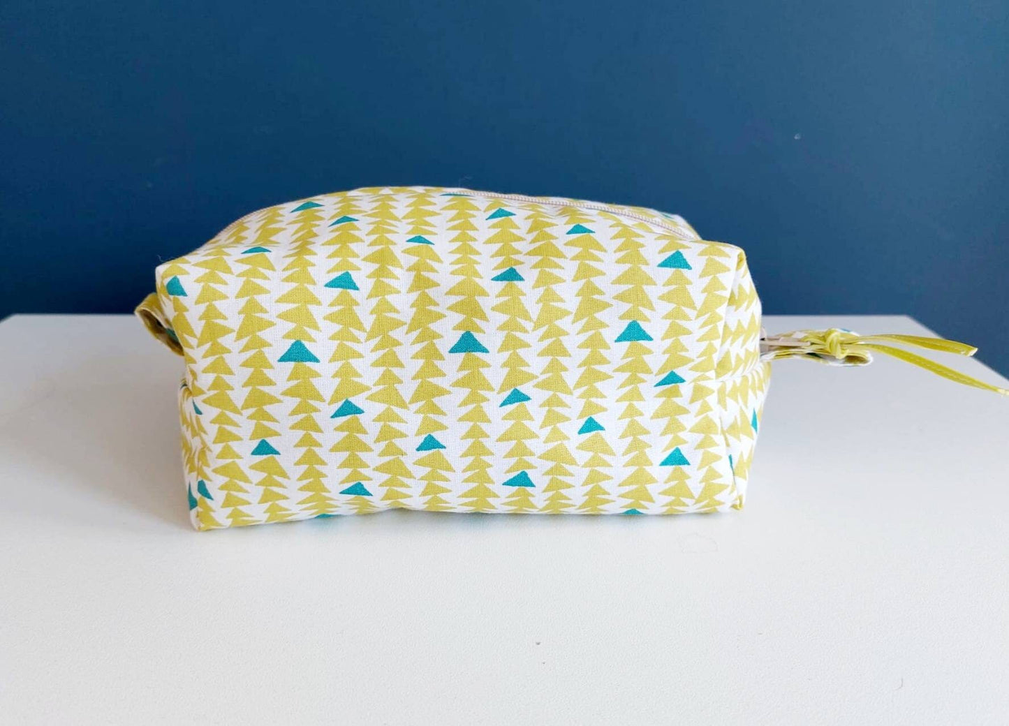 Triangle print cosmetic bag in green and teal