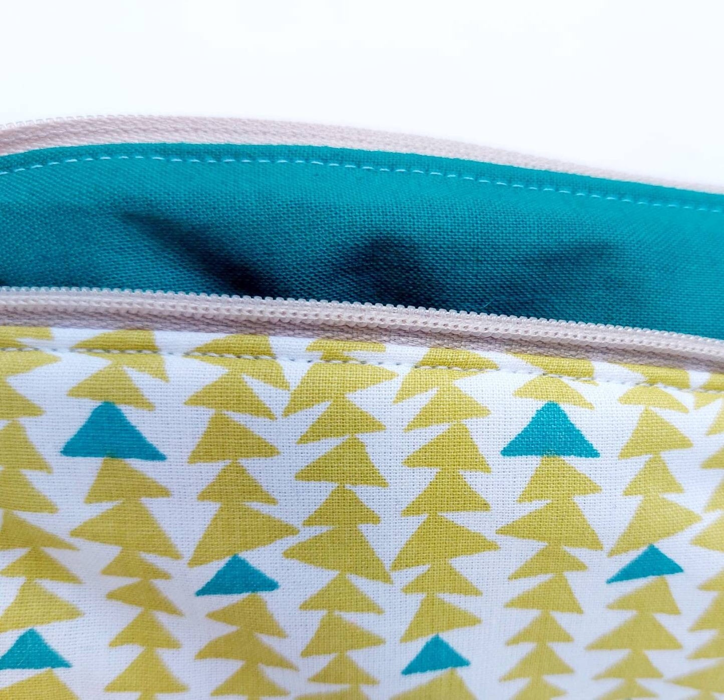 Triangle print cosmetic bag in green and teal