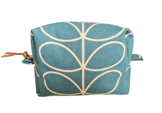 Linear stem print cosmetic bag in teal